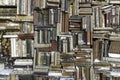 Old books piled on a wall, stacked in a disorderly fashion