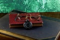 Old Books with Pocket Watch and Spectacles on a Wooden Table Top Royalty Free Stock Photo