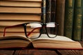 Old books and reading glasses on desk in library room Royalty Free Stock Photo