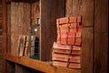 Old books, rewound with a rope, stand on a wooden shelf. Royalty Free Stock Photo