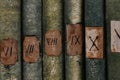 Old books with Roman numerals in the library