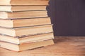 Old books row on the chalk board background Royalty Free Stock Photo