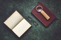 Old books, spectacles, and a magnifying glass with a leather handle, dark and moody, top view Royalty Free Stock Photo