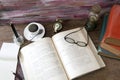 Old books storm lantern coffee cup, compass, glasses and pencil Royalty Free Stock Photo