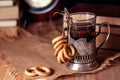 Old books and tea in the evening. A glass of drink on table. The Royalty Free Stock Photo