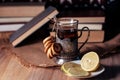 Old books and tea in the evening. A glass of drink on table. The Royalty Free Stock Photo