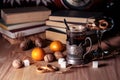 Old books and tea in the evening. A glass of drink on table. The Royalty Free Stock Photo