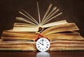 Old books and vintage clock face, storytelling Royalty Free Stock Photo