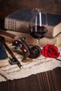 Old books, violin scroll and red rose Royalty Free Stock Photo