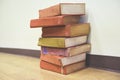 Old books on a wooden floor - Book stack in the library room for business and education wall background , back to school concept Royalty Free Stock Photo