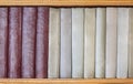 Old books on a wooden shelf close-up. Side view. Royalty Free Stock Photo