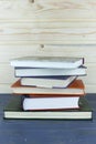 Old books on a wooden shelf.