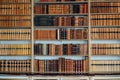 Old books on wooden shelf. Tiled Bookshelf background. historical old books in the old personal library. Concept on the Royalty Free Stock Photo