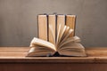 Old books on wooden table over rustic background. Education concept Royalty Free Stock Photo