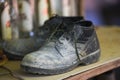 Old Boots, black shoes dirty on the shoe rack, military boots