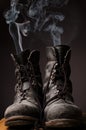 Old boots with smoke Royalty Free Stock Photo