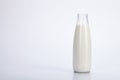 Old bottle glass of milk on white background. Royalty Free Stock Photo