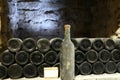 Old bottle of wine in the cellar of the winery Ancient wine bottles in the cellar WineryRed wine of ancient times