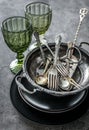Old bowls, spoons and silverware, heavy greenish glasses Royalty Free Stock Photo