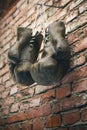 Old boxing gloves hang on nail on brick wall with copy space for text. High resolution 3d render Royalty Free Stock Photo