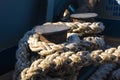 Old braided rope on the wooden deck of a sea boat