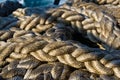 Old braided rope on the wooden deck of a sea boat