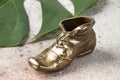 Old brass ashtray in the shape of a shoe