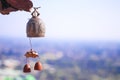 Old brass bell hanging on blurred city and sky background Royalty Free Stock Photo