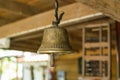 Old brass bell hanging on the ceiling. Royalty Free Stock Photo