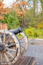 The old brass cannons in the battlefield.old metal cannons standing on two wooden supports on a grassy lawn or field Royalty Free Stock Photo