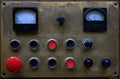 An old brass dashboard with buttons and sensors from the machine. Vintage remote control.