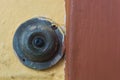 Old brass doorbell button Outside a House.