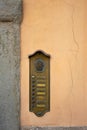 Old brass doorbell in Italy with blank space