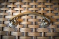 Old brass handle on bamboo weaving