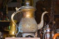 Old brass kettle, artfully decorated with stamping Royalty Free Stock Photo