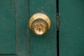 Old brass knobs on the green door Royalty Free Stock Photo