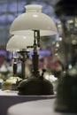 Old brass lamp Use kerosene The combination point on the table at night, the ancient color image.soft focus.The old lamp illuminat Royalty Free Stock Photo