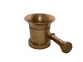 Old brass mortar and pestle lying next to it, isolated. Equipment for grinding and blending different ingredients. Concept of Royalty Free Stock Photo