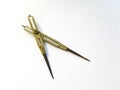 Old brass reduction compass or proportional scale divider. Geometry tool used to scale designs Royalty Free Stock Photo