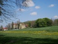 Old brewery in Stegen near Munich - historic plant building, green and yellow field in sunny blue sky day Royalty Free Stock Photo