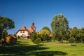 Old baroque church in countryside with trees Royalty Free Stock Photo