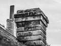 Old brick brick chimney on the house roof Royalty Free Stock Photo