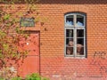 Old brick building with broken windows