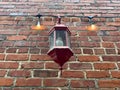 Old brick building facade holiday lights vintage lamp looking up Royalty Free Stock Photo