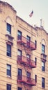 Old brick building with fire escape, color toning applied, New York City, USA Royalty Free Stock Photo