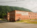 Old brick building with Hinton Hardwoods painted sign, in Hinton, West Virginia Royalty Free Stock Photo
