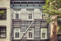 Old brick building with iron fire escape, color toning applied, New York City, USA Royalty Free Stock Photo