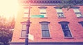 Old brick building with Manhattan Avenue sign, color toning applied, New York City, USA Royalty Free Stock Photo