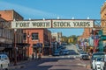 old brick buildings in Fort Worth at Stockyards, the former cattle market with historic entry signage