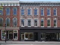 old brick buildings with stores at street level and apartments above